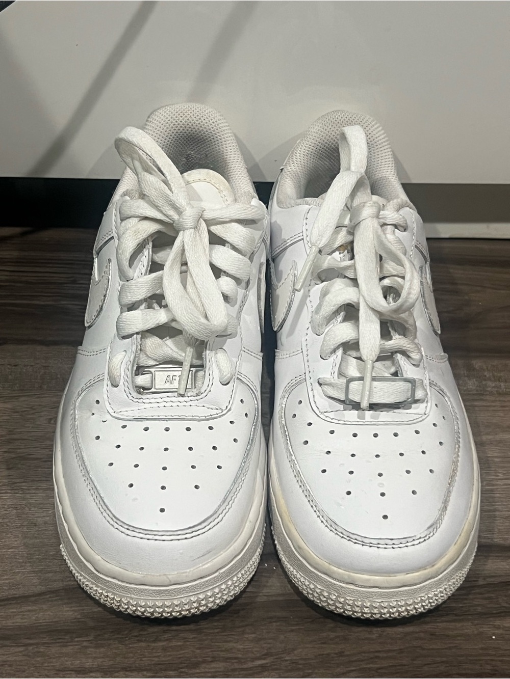 all-white Nike Air Force 1 Low sneakers